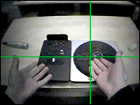 The gamer looks at the controls and complains that the controls are the wrong way around, the green button is to the left, but on the highway on screen the green track is to the right.