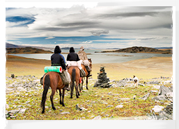 Horseriders in Mongolian wildernesss
