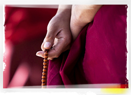 Prayer beads in monk's hand, Nepal