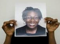 Dr Vanessa Anderson holding a photo of Dr Vanessa Anderson